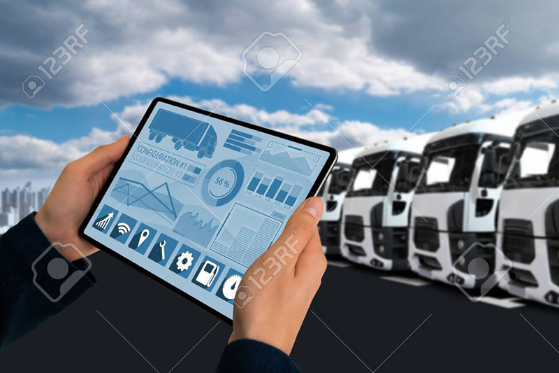 151589131 Manager With A Digital Tablet On The Background Of Trucks Fleet Management 800